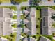 Birds-eye view of community featuring well-manicured lawns, neatly arranged homes, and tree-lined streets at 6428 Thicket Trl, New Port Richey, FL 34653