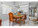Dining area features a wooden table, seating for four, and a decorative hanging light at 6428 Thicket Trl, New Port Richey, FL 34653