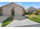The large driveway and well-manicured front yard add curb appeal to this cozy home at 6428 Thicket Trl, New Port Richey, FL 34653