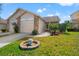 Charming single-story home featuring a one car garage, well-maintained lawn, and lovely landscaping at 6428 Thicket Trl, New Port Richey, FL 34653