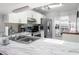 Bright kitchen features a stainless steel sink, ample counter space, and a large window at 6428 Thicket Trl, New Port Richey, FL 34653