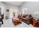 Open living area with sliding glass doors and comfortable seating, providing a bright space at 6428 Thicket Trl, New Port Richey, FL 34653