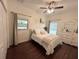 Bright bedroom with natural light, ceiling fan, window, and light-colored walls at 7203 Spring Valley Dr, Tampa, FL 33615