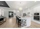 Modern kitchen with a large island, barstool seating, and stainless steel appliances at 7934 Lakes Edge Ln, Port Charlotte, FL 33981