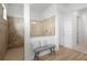Modern tiled shower with glass enclosure and bench seating offering a relaxing spa experience at 7934 Lakes Edge Ln, Port Charlotte, FL 33981