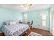 Bright bedroom with coastal-themed decor and hardwood floors at 8341 Moulton Dr, Port Richey, FL 34668