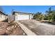 Charming single-story home featuring an attached two-car garage and an expansive driveway at 8341 Moulton Dr, Port Richey, FL 34668