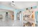 Open concept living area with a cat tree, kitchen, and easy access to other rooms at 8341 Moulton Dr, Port Richey, FL 34668