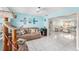Comfortable living room with an open layout, tile flooring, and ample natural light at 8341 Moulton Dr, Port Richey, FL 34668