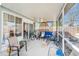 Covered patio with outdoor furniture and screen at 8341 Moulton Dr, Port Richey, FL 34668