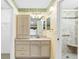 Bathroom with a vanity and a walk-in shower featuring a built-in seat and grab bars at 988 Villeroy Greens Dr, Sun City Center, FL 33573