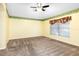 Spacious bedroom with carpeted floor and a large window allowing for plenty of natural light at 988 Villeroy Greens Dr, Sun City Center, FL 33573