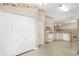 Well-lit kitchen boasting lots of cabinet space, standard appliances, and a neutral color scheme at 988 Villeroy Greens Dr, Sun City Center, FL 33573