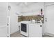 Bright laundry room features a washer, dryer, and plenty of storage space at 988 Villeroy Greens Dr, Sun City Center, FL 33573