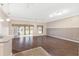 Bright living room with hardwood floors, sliding glass doors, and a neutral color scheme at 988 Villeroy Greens Dr, Sun City Center, FL 33573