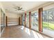 Bright and airy sunroom features tile floors, ceiling fan, and access to the outdoor space at 988 Villeroy Greens Dr, Sun City Center, FL 33573