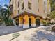 Apartment complex exterior with archways and decorative roof at 100 4Th S Ave # 109, St Petersburg, FL 33701