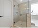 Bathroom shower with glass door with tile surround. Modern look with accent tiles at 10136 Grand Oak Cir, Madeira Beach, FL 33708