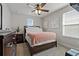 Bedroom featuring cozy neutral tones, natural light, and calming decor at 10136 Grand Oak Cir, Madeira Beach, FL 33708