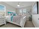 Bright bedroom with a large bed, accent pillows, and plenty of natural light at 10136 Grand Oak Cir, Madeira Beach, FL 33708