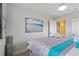 A peaceful bedroom featuring beach-themed decor and ample natural light at 10136 Grand Oak Cir, Madeira Beach, FL 33708