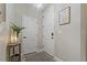 Hallway features decoratively framed art and a modern light fixture at 10136 Grand Oak Cir, Madeira Beach, FL 33708