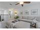 Open living space with a large sectional sofa, plush ottoman and access to the laundry room at 10136 Grand Oak Cir, Madeira Beach, FL 33708