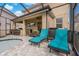 Covered patio with bar, lounge area, and outdoor dining near the pool at 10136 Grand Oak Cir, Madeira Beach, FL 33708