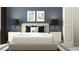 Bedroom features a decorative headboard, two end tables, and coordinating decorative pillows at 10807 Fort White Ct, Tampa, FL 33647