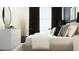 Bedroom with natural light features a dresser, full bed, and decorative pillows at 10807 Fort White Ct, Tampa, FL 33647