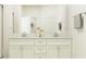 Elegant bathroom featuring a double vanity with stylish fixtures and neutral decor at 11870 Sparkling Topaz Cv, Parrish, FL 34219