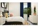 Inviting bedroom showcases stylish decor, a cozy bed with stylish pillows and a patterned rug at 11870 Sparkling Topaz Cv, Parrish, FL 34219