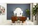 Contemporary home office with sleek desk, comfortable seating, stylish decor, and abundant natural light at 11870 Sparkling Topaz Cv, Parrish, FL 34219