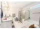 Bathroom features dual vanity sinks, shower with glass door, and a separate soaking tub at 12593 Palapa Loop, Spring Hill, FL 34610