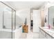 Bathroom features dual vanity sinks, shower with glass door, and a separate soaking tub at 12593 Palapa Loop, Spring Hill, FL 34610