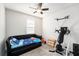 Bedroom with carpet, a ceiling fan, and natural light from the window at 12593 Palapa Loop, Spring Hill, FL 34610