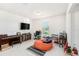 Bright room with tile floors, neutral walls, and large windows for natural light at 12593 Palapa Loop, Spring Hill, FL 34610