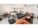 Open-concept living room with tile floors, neutral walls, recessed lights, a ceiling fan, and comfortable seating at 12593 Palapa Loop, Spring Hill, FL 34610