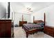 Primary bedroom features a ceiling fan, large window, and classic furnishings at 12593 Palapa Loop, Spring Hill, FL 34610
