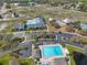 Aerial image showcasing community pool, clubhouse, parking, and tennis courts, promoting active lifestyles at 13024 Prestwick Dr, Riverview, FL 33579