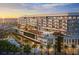 Luxurious beachfront resort featuring multiple pools, dining, palm trees, and stunning ocean views at sunset at 15000 Madeira Way # 512, Madeira Beach, FL 33708