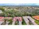 Wide aerial view of a residential neighborhood featuring homes with tile roofs and lush landscaping at 16112 Amethyst Key Dr, Wimauma, FL 33598