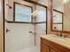 Modern bathroom featuring a glass shower enclosure and decorative tile accents at 16112 Amethyst Key Dr, Wimauma, FL 33598