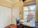 Bright breakfast nook featuring a marble table, window with a view, and wood-look tile flooring at 16112 Amethyst Key Dr, Wimauma, FL 33598