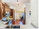 Kitchen with stainless steel appliances, tile backsplash and hardwood flooring at 16112 Amethyst Key Dr, Wimauma, FL 33598