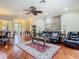 Open living room with hardwood floors, lots of light, and comfortable seating at 16112 Amethyst Key Dr, Wimauma, FL 33598