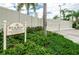 Gated RV and boat storage area with lush landscaping and mature palm trees at 16112 Amethyst Key Dr, Wimauma, FL 33598