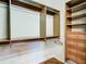 Spacious walk-in closet featuring wood shelving, drawers and metal rods for hanging clothes at 16112 Amethyst Key Dr, Wimauma, FL 33598