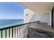 Spacious balcony overlooking beautiful blue and green ocean waters and seating area at 1660 Gulf Blvd # Ph2, Clearwater Beach, FL 33767