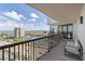 Balcony view overlooking a waterfront neighborhood with high-rise buildings and a marina filled with boats at 1660 Gulf Blvd # Ph2, Clearwater Beach, FL 33767